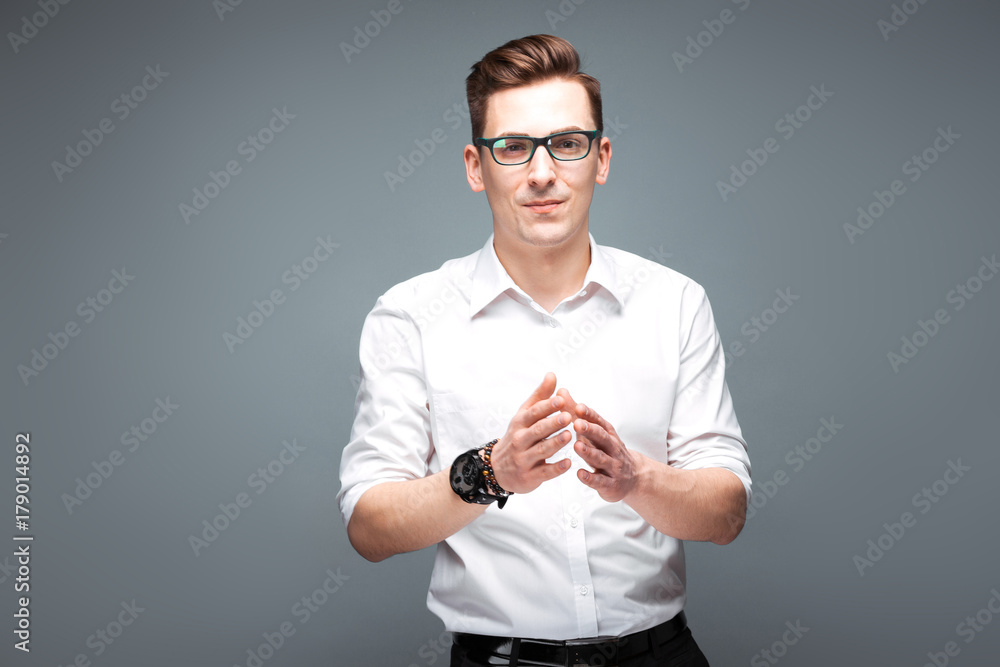 Φωτογραφία Attractive mature businessman in costly watch, black glasses and white shirt