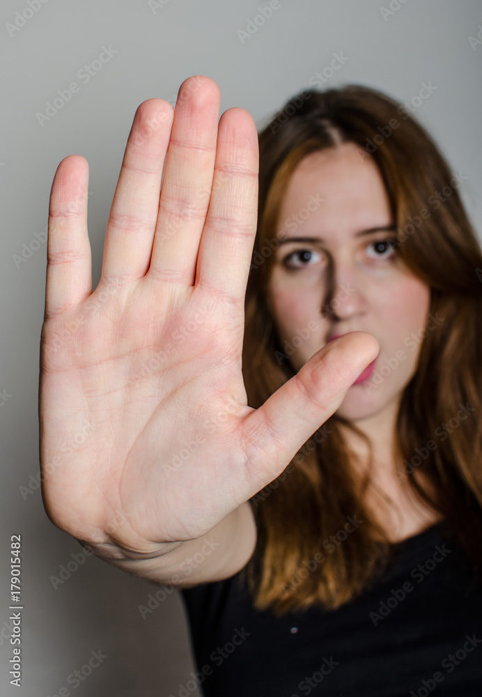 Woman showing hand of stop Woman showing hand of stop