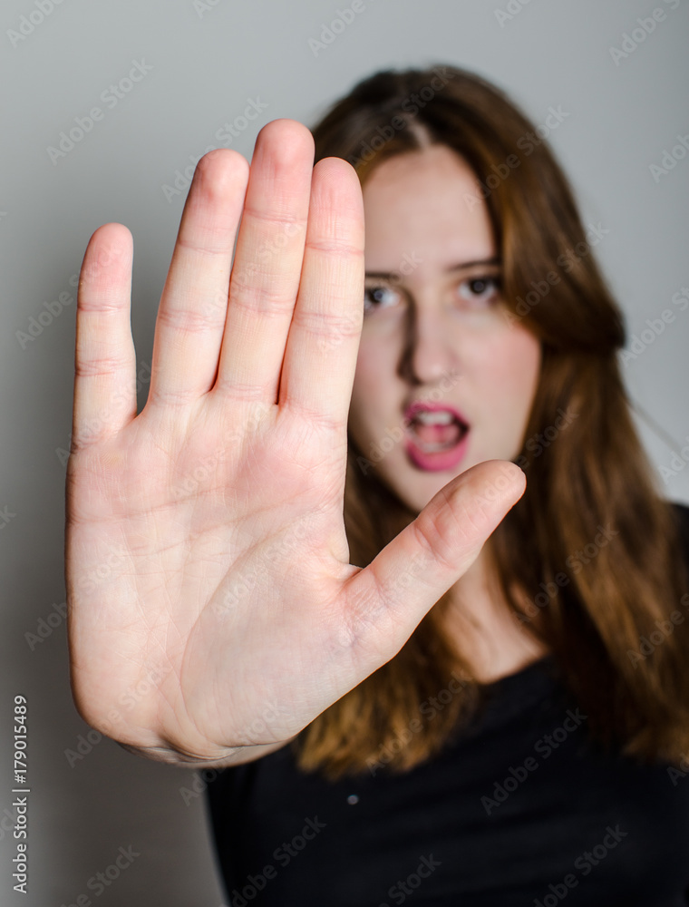 Woman showing hand of stop Woman showing hand of stop