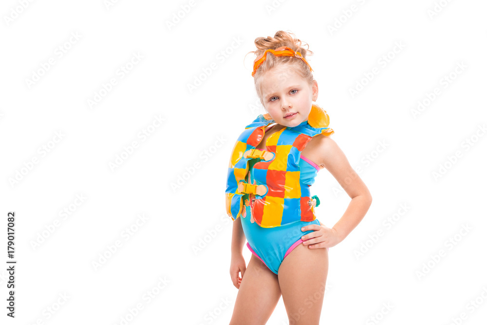 Beautiful little girl in in blue swimming suit and colorful life jacket Beautiful little girl in in blue swimming suit and colorful life jacket