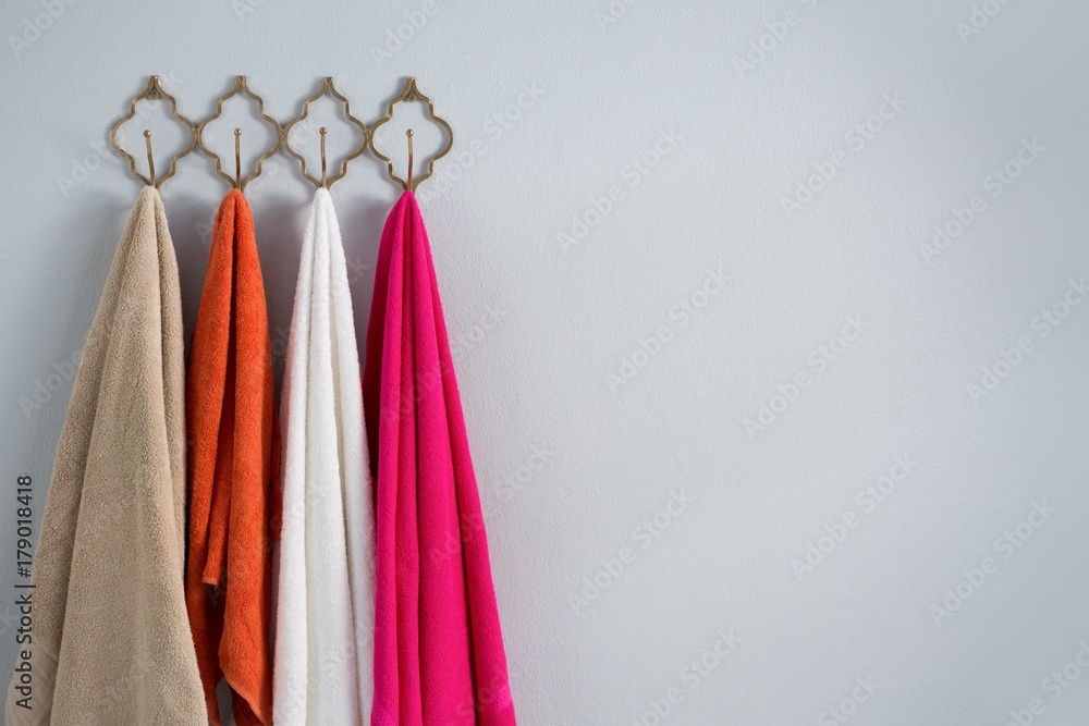 Fotografie Colorful towels hanging on hook