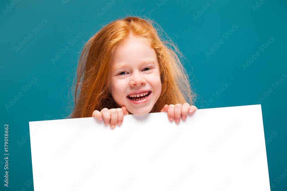 Cute beauty little girl in tee shirt with long hair hold clean paper Cute beauty little girl in tee shirt with long hair hold clean paper