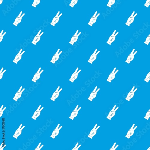 Hand showing victory sign pattern seamless blue © ylivdesign