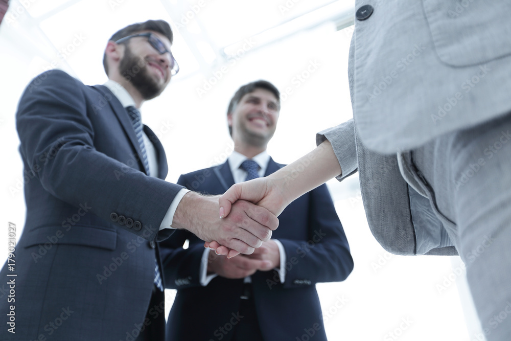 Close-up of business people shaking hands Close-up of business people shaking hands