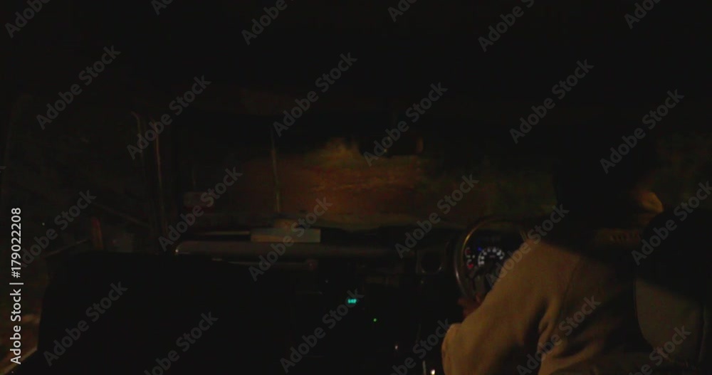 Night time in a tourist land cruiser safari through Maasai Mara National Park, Kenya, Africa Night time in a tourist land cruiser safari through Maasai Mara National Park, Kenya, Africa