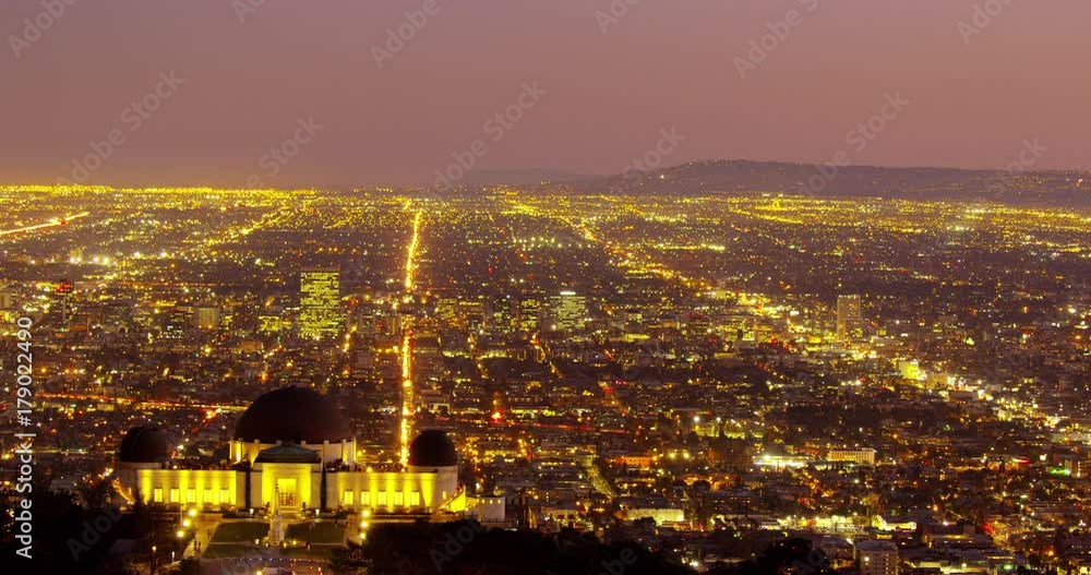 Timelapse of The Griffith Observatory and LA skyline in the distance in Los Angeles, California. Timelapse of The Griffith Observatory and LA skyline in the distance in Los Angeles, California.