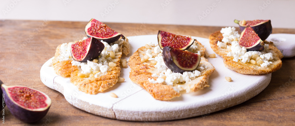 Fragrant bruschetta with figs, cheese and honey. A great snack to blame. Kitchen of Provence. Italian appetizer. Fragrant bruschetta with figs, cheese and honey. A great snack to blame. Kitchen of Provence. Italian appetizer.