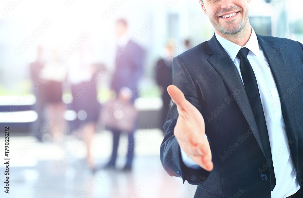 Portrait of a successful businessman giving a hand Portrait of a successful businessman giving a hand