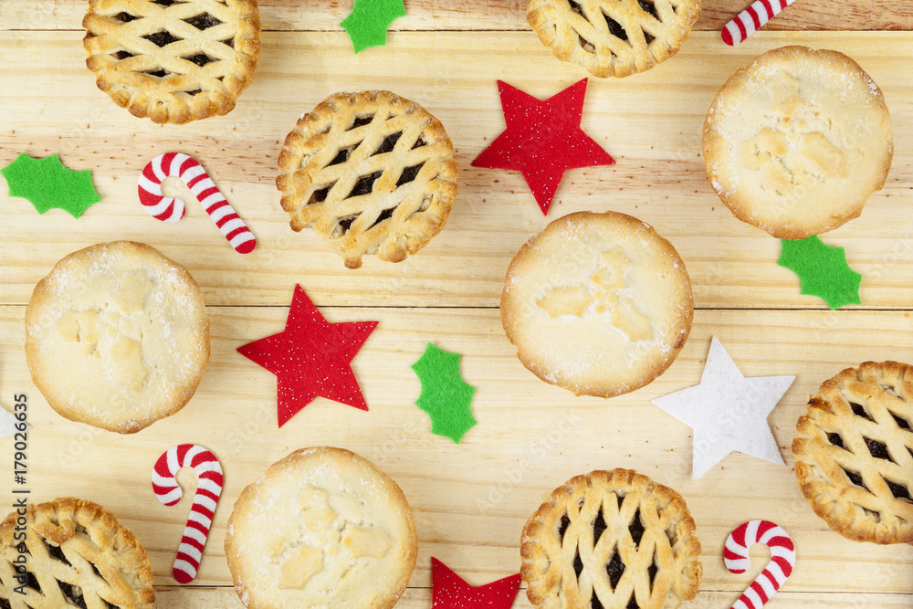 Selection of mince pies and christmas decorations