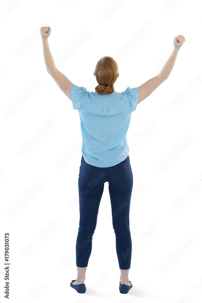 Female executive standing with arms up against white background Female executive standing with arms up against white background