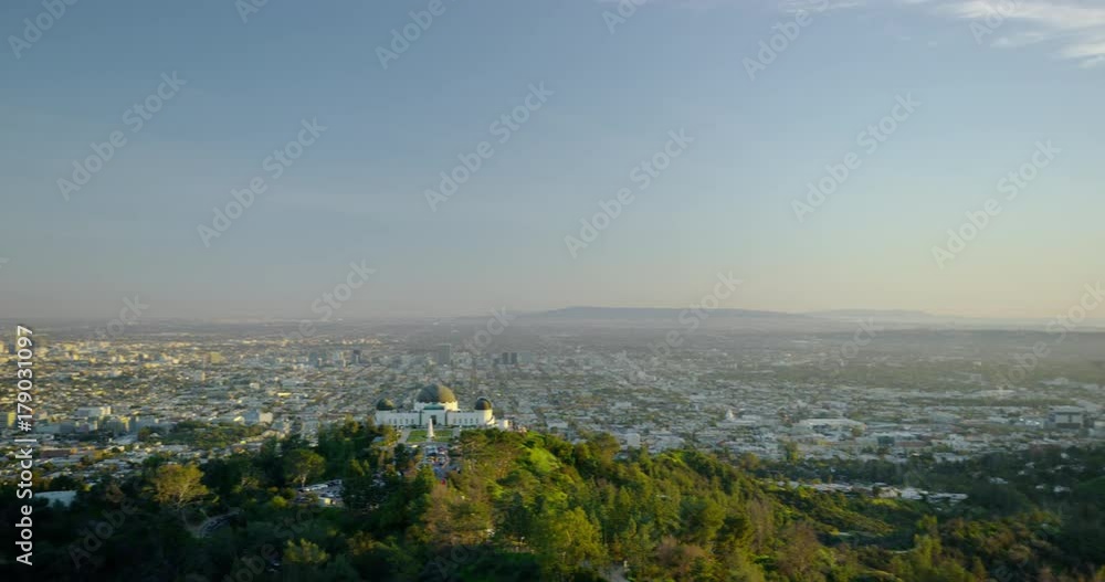 The Griffith Observatory and downtown LA skyline in the distance in Los Angeles, California. The Griffith Observatory and downtown LA skyline in the distance in Los Angeles, California.