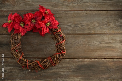 Christmas wreath on wooden plank