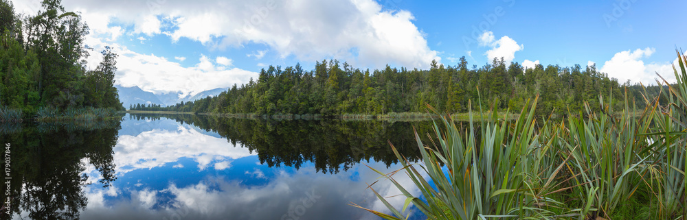 Reflection of mountains in the lake Matheson, New Zealand