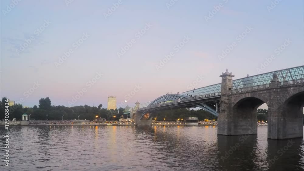 backlight turns on the bridge in the summer evening timelapse backlight turns on the bridge in the summer evening timelapse