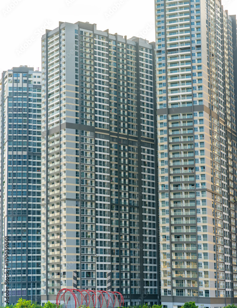 Ho Chi Minh City, Vietnam - November 30th, 2017: Skyscrapers viewed from below towards sky represents urban development with modern architecture to bring international in Ho Chi Minh City, Vietnam Ho Chi Minh City, Vietnam - November 30th, 2017: Skyscrapers viewed from below towards sky represents urban development with modern architecture to bring international in Ho Chi Minh City, Vietnam