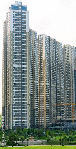 Ho Chi Minh City  Vietnam - November 30th  2017  Skyscrapers viewed from below towards sky represents urban development with modern architecture to bring international in Ho Chi Minh City  Vietnam