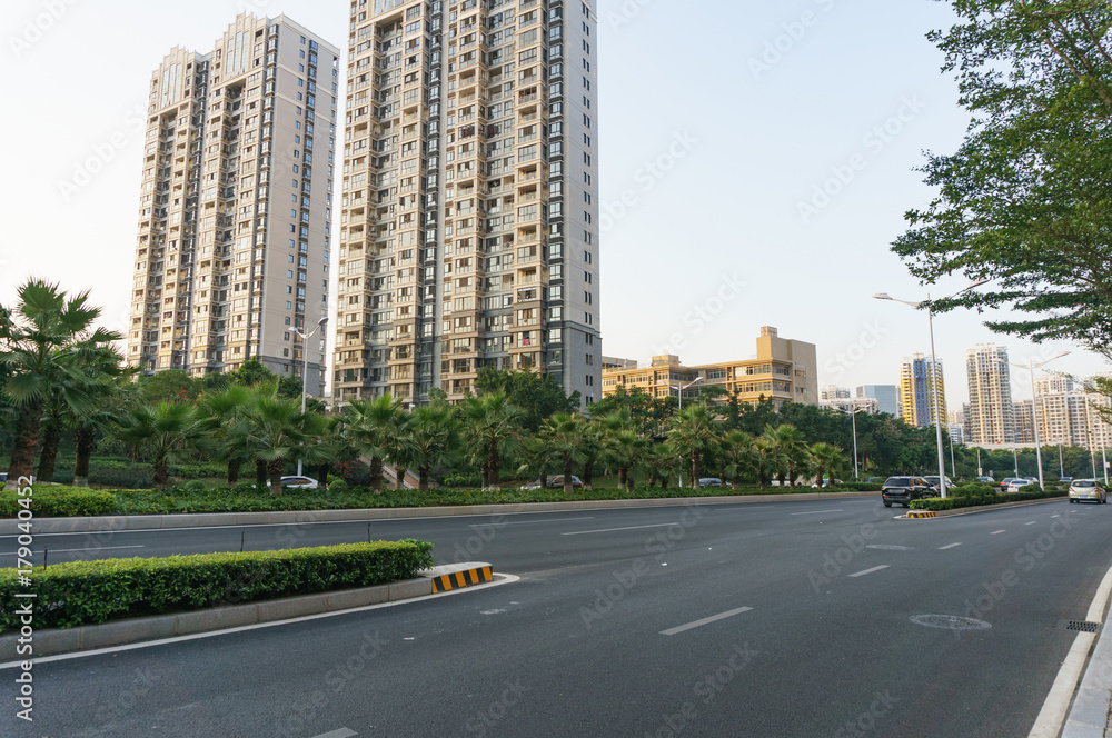 Road with modern building background during rush hour