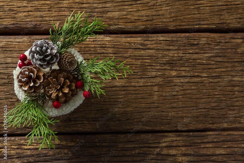Pine cones and twigs with cherry in bowl Pine cones and twigs with cherry in bowl