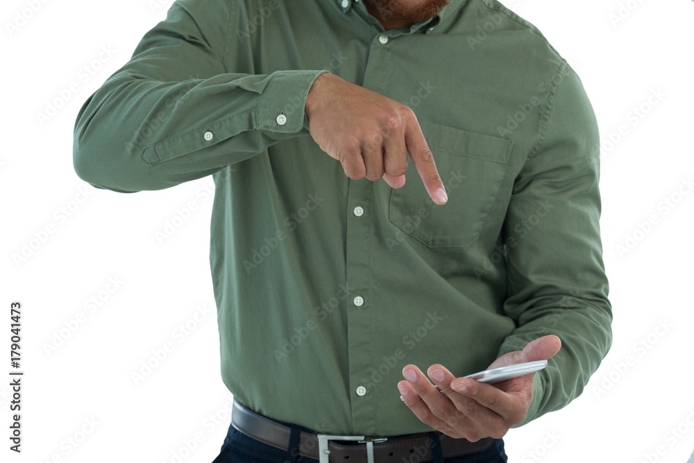 Male executive pretending to use an invisible screen Male executive pretending to use an invisible screen