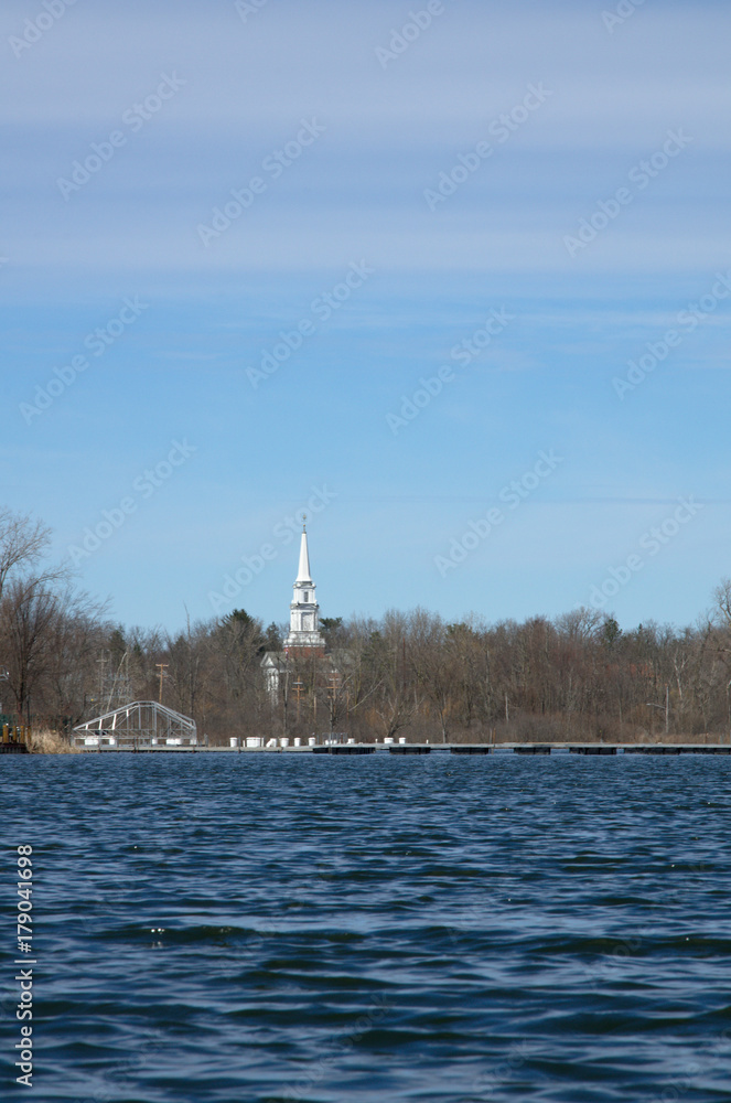 A small church on the shore of a lake A small church on the shore of a lake