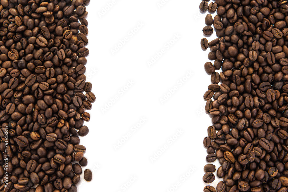 roasted coffee beans, can be used as a background, Beans isolated on white background, Free from copy space. roasted coffee beans, can be used as a background, Beans isolated on white background, Free from copy space.