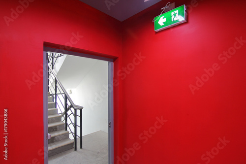Emergency exit of the building with fire exit sign and fire escape.