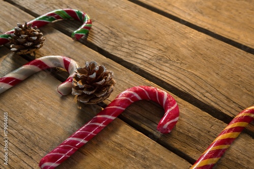 High angle view of colorful candy canes with pine cones photo