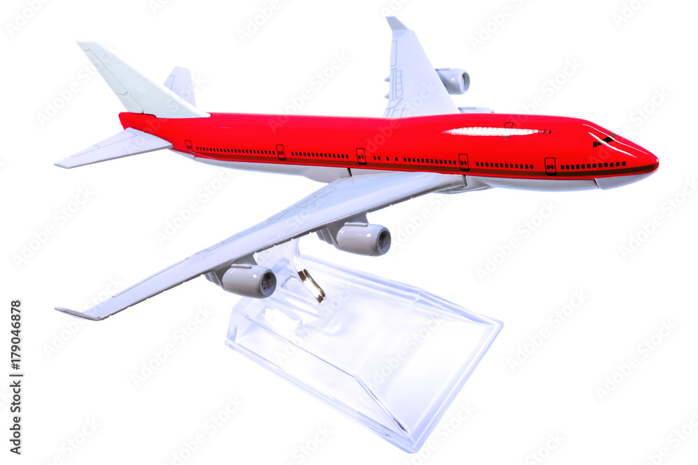 maquette rouge d'avion de ligne sur support, fond blanc maquette rouge d'avion de ligne sur support, fond blanc