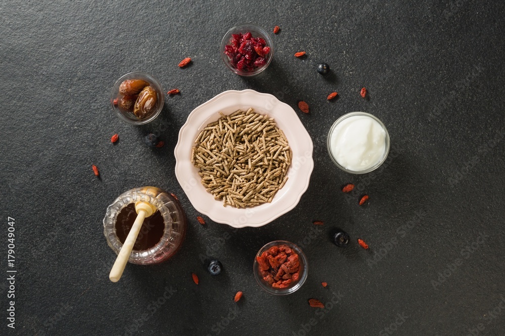 Bowl of cereal bran stick, yogurt, honey and dried fruits Bowl of cereal bran stick, yogurt, honey and dried fruits