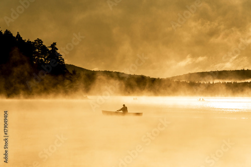 Canada Ontario Lake of two rivers Canoe Canoes foggy water sunrise fog golden hour on water in Algonquin National Park