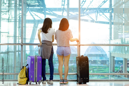 Traveler together in airport concept, Young asian backpack with carrying hold luggage and passenger for tour travel booking ticket flight international vacation in holiday relaxation.