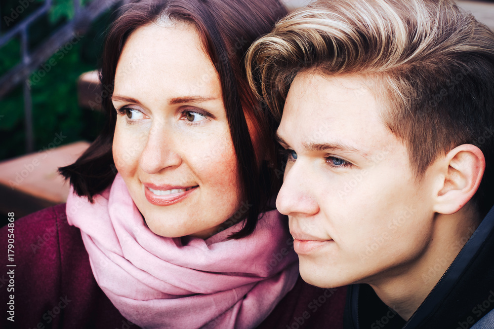 Young mother and adult son outdoor in a autumn Young mother and adult son outdoor in a autumn
