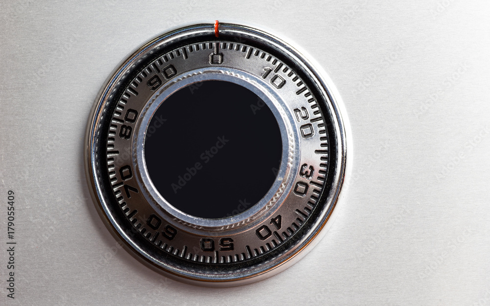 Closed up image of steel safe dial lock. Closed up image of steel safe dial lock.