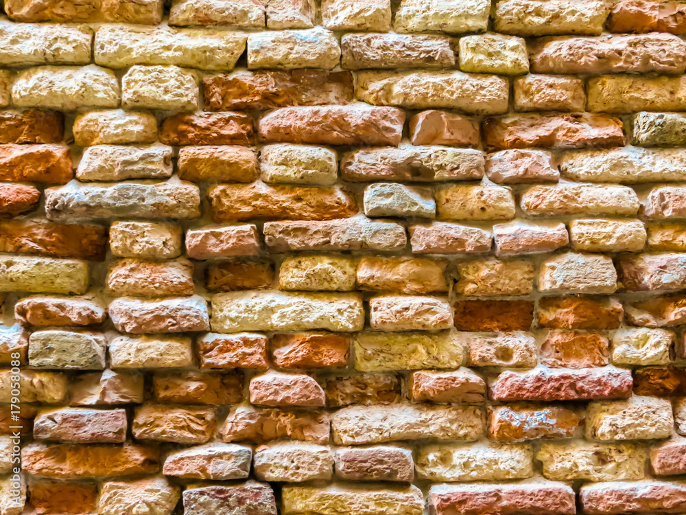 Ancient half-ruined brick wall
