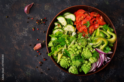 Vegan salad of fresh vegetables and cabbage romanesko. Dietary menu. Proper nutrition. Flat lay. Top view photo