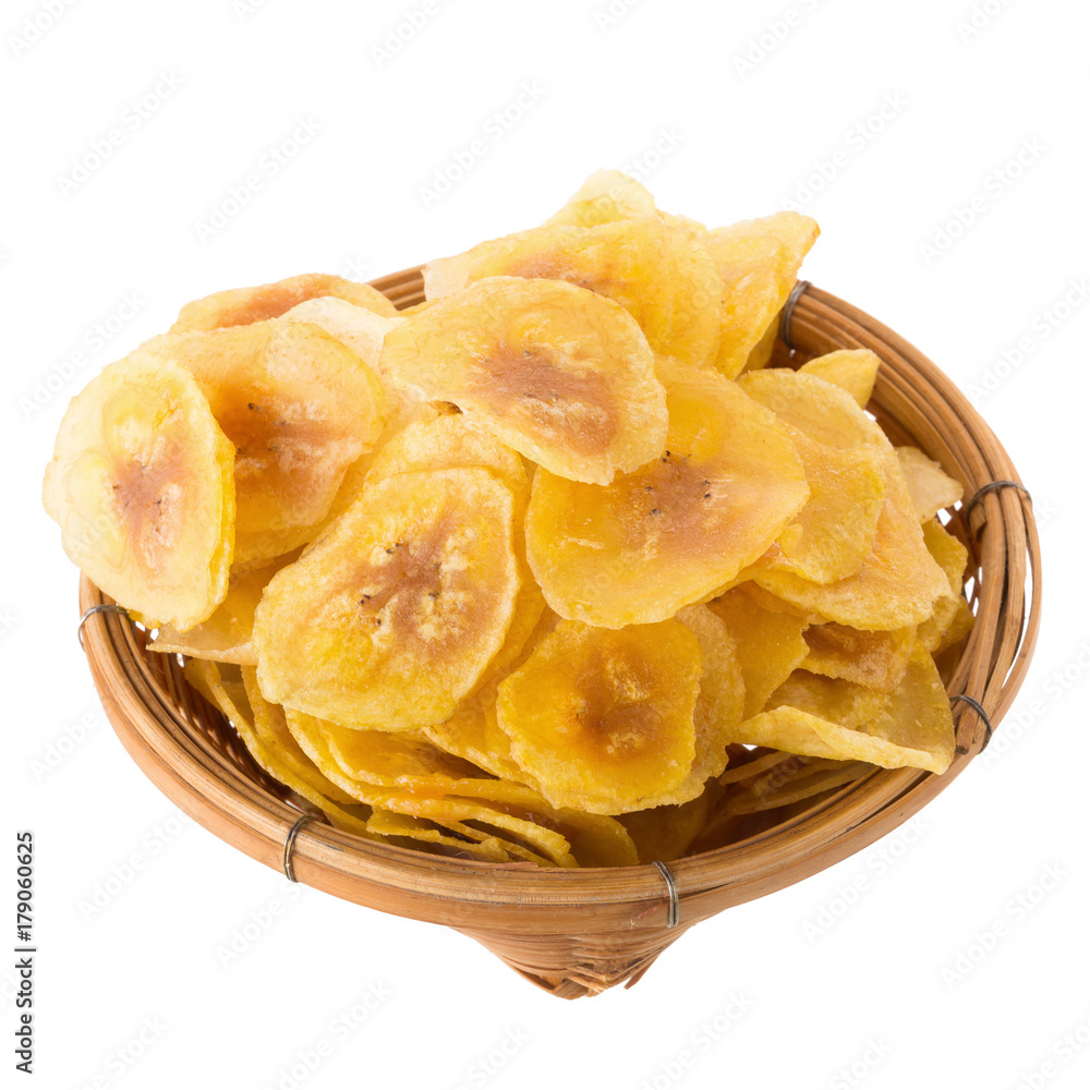 Dried banana chips in wooden bowl. Yellow deep fried slices of bananas Isolated on white background Dried banana chips in wooden bowl. Yellow deep fried slices of bananas Isolated on white background