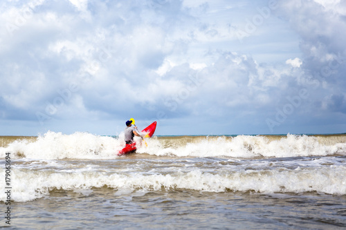 Man doing kayak surfing in the sea © bignai