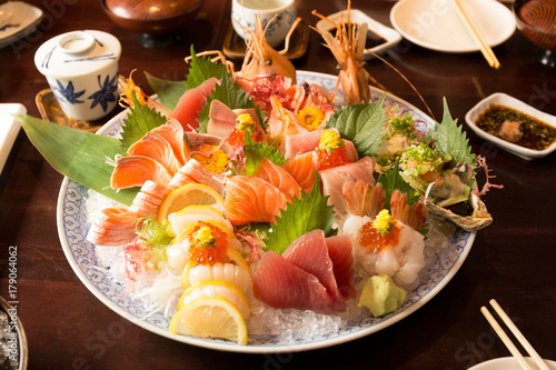 Bowl of sushi with tuna salmon oyster and shrimp