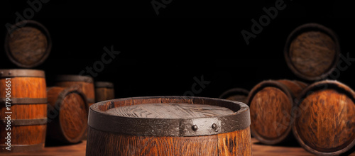 Fényképezés Rustic wooden barrel on a night background