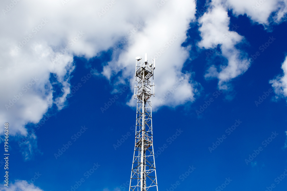 Metal cell phone tower on blue sky background Metal cell phone tower on blue sky background