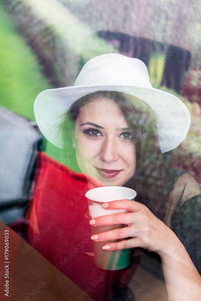 Beautiful girl drinking coffee at the coffee shop Beautiful girl drinking coffee at the coffee shop