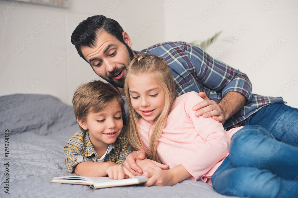 family reading book together family reading book together