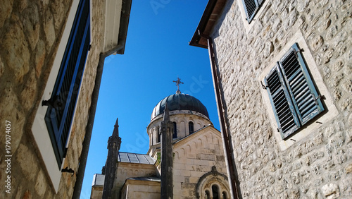 Orthodox Cathedral of Archangel Michael in Herceg Novi in Montenegro. The view from the side of one of the streets with shutters and windows