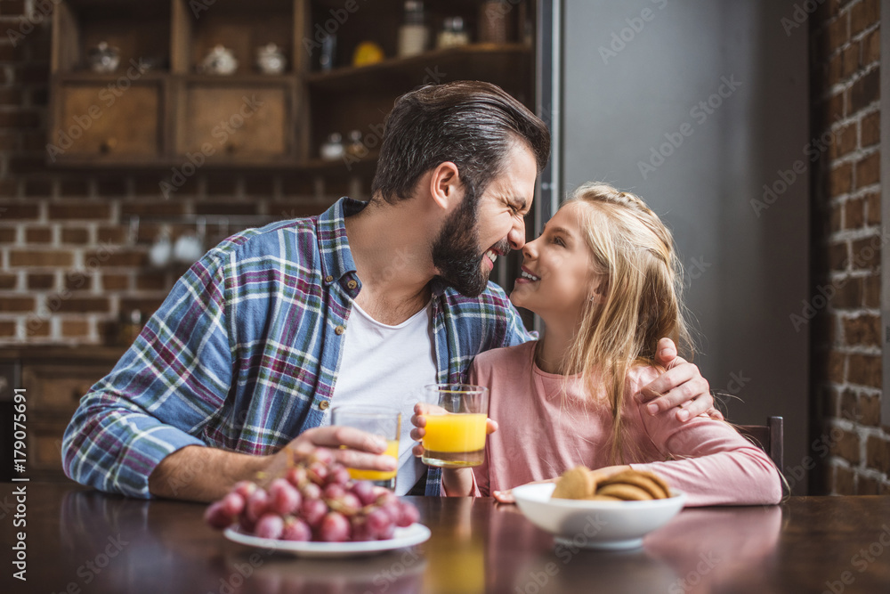father and daughter having breakfast