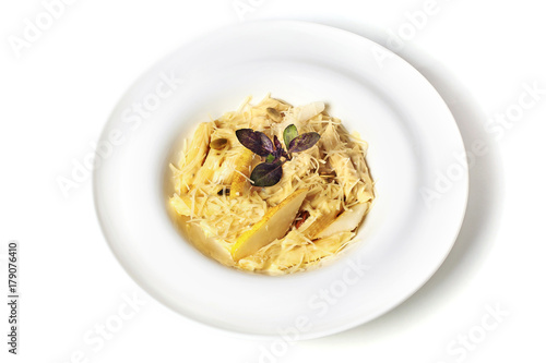 Pasta with pear, basil and cream. Isolated on white. Top view