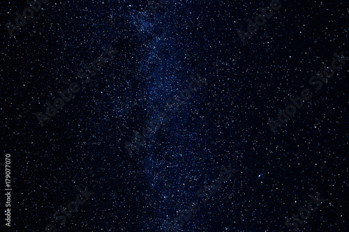 Milky way galaxy with shining stars and planets in the universe. Blue night sky background.