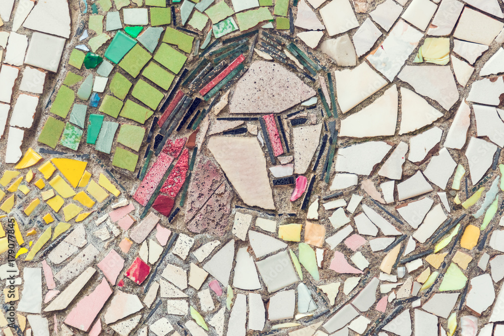 Obraz premium Detail of beautiful old abstract ceramic mosaic with the image of the woman's face