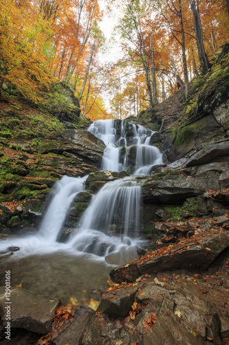 Landscape of waterfall Shypit in the Ukrainian Carpathian Mountains on the long exposure in autumn