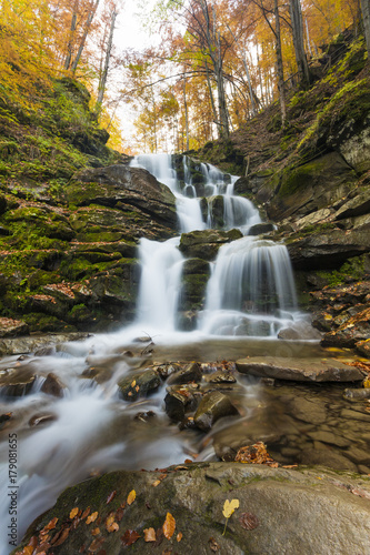 Landscape of waterfall Shypit in the Ukrainian Carpathian Mountains on the long exposure in autumn