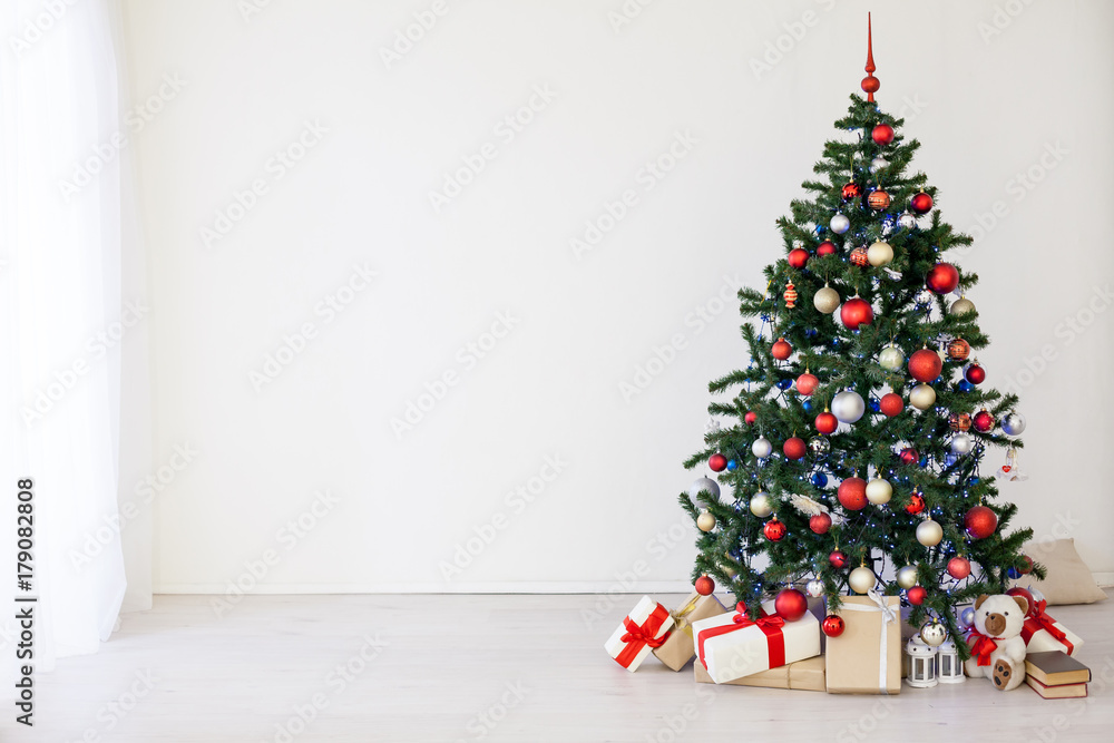 Christmas tree with red gifts in the white room Christmas Christmas tree with red gifts in the white room Christmas